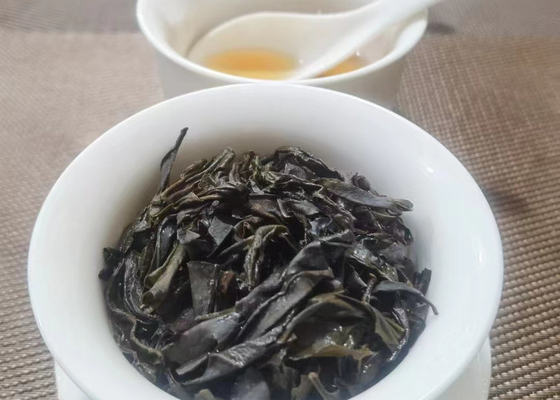 ۲۰۲۲ بهار چای تازه چای سیاه کوه ووئی چنگ شان گل های کوچک میوه دار چای وحشی کوهستان بلند تونگمو گوان سان